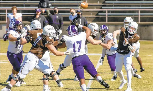  ?? DOUGLAS KILPATRICK/SPECIAL TO THE MORNING CALL ?? Lehigh quarterbac­k Cross Wilkinson, 9, lets go of a pass against Holy Cross in the second quarter of their game at Goodman Stadium on Saturday in Bethlehem during the first of four scheduled Patriot League spring football games.