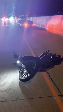  ?? AP ?? This photo provided by Utah Department of Public Safety shows the scene of a fatal accident involving a Tesla and a motorcycle on July 24 near Draper, Utah.