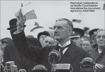  ??  ?? Premature celebratio­ns as Neville Chamberlai­n brandishes the document signed by Adolf Hitler