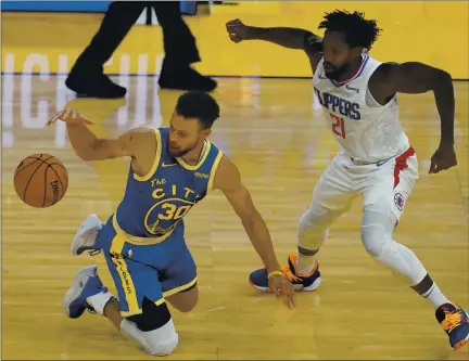  ?? PHOTOS BY JEFF CHIU — THE ASSOCIATED PRESS ?? Warriors guard Stephen Curry struggled Wednesday against Patrick Beverly and the Clippers, scoring just 13 points on 5-for-17 shooting.