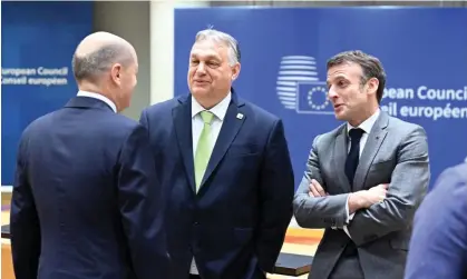  ?? Photograph: Anadolu/Getty Images ?? Hungarian PM Viktor Orbán (centre) and French president Emmanuel Macron (right) at the summit. The agreement was made after wording was tweaked to address opposition by Hungary.