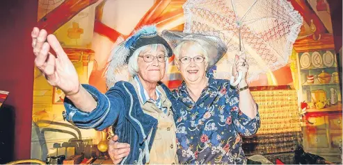  ?? Picture: Steve MacDougall. ?? Memory collective members Anne Shah, left, and Freda Cummings do a spot of dressing up.