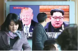  ?? (AP) ?? ALMOST ON TALKING TERMS – The images of US President Donald Trump and North Korean leader Kim Jong-un appear on a giant TV screen at a railway station in Seoul, South Korea, Monday. North Korea says Kim is ready to discuss his nuclear weapons program...