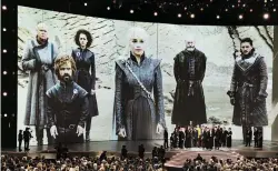  ?? (AP) ?? FANTASY EPIC – “Game of Thrones” cast and crew members accept the Emmy Award for Best Drama during presentati­on night Monday at the Microsoft Theatre in Los Angeles, California.