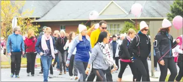  ??  ?? And, they’re off. Some of the walkers who helped raise $84,000 for the BMP Foundation leave the TBL Community Centre