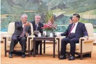  ?? ANDY WONG/AP ?? U.S. Secretary of State Rex Tillerson, left, chats with China’s President Xi Jinping during a meeting at the Great Hall of the People in Beijing Saturday.