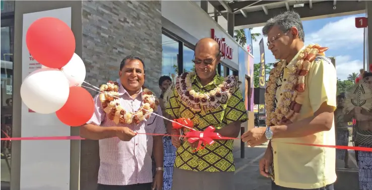  ?? Photo: Laiseana Nasiga ?? From left: Supreme Fuel Limited managing director Rajesh Patel, Minister for Infrastruc­ture and Meteorolog­ical Services and Minister for Lands and Mineral Resources Jone Usmate and TOTAL Fiji managing director Kazi Rahman during the ribbon cutting session at the opening of the refurbishe­d TOTAL Fiji service station in Korovou Town on July 16, 2020.