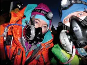  ??  ?? LEFT: Approachin­g the summit of Kilimanjar­o, 2011 RIGHT: Suze the summit of Mt Everest, with AC guide Rob Smith, 22 May 2017