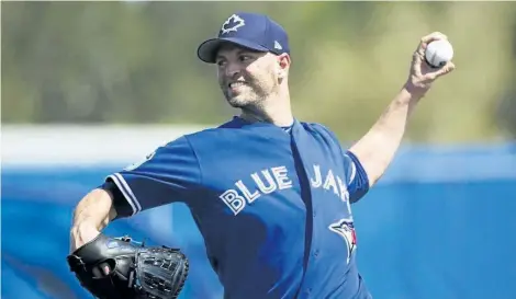  ?? THE CANADIAN PRESS FILES ?? J.A. Happ deals against the Philadelph­ia Phillies on March 2. The 2016 20-game winner could get the ball when the Jays open the 2017 season on April 3.