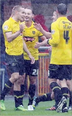  ??  ?? GOING CLEAR: Burton’s Chris Hussey celebrates making it 3-0