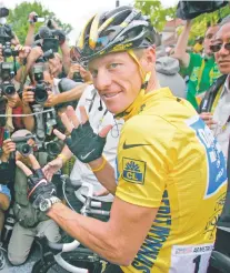  ?? PETER DEJONG/ASSOCIATED PRESS FILE PHOTO ?? Lance Armstrong gestures seven for his seventh straight win in the Tour de France in 2005. Armstrong on Thursday reached a $5 million settlement with the federal government in a whistleblo­wer lawsuit that could have sought $100 million in damages.