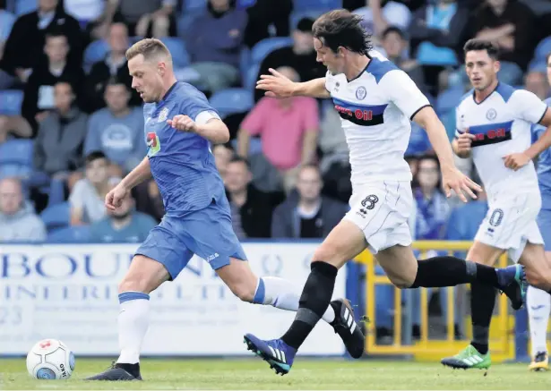  ?? Www.mphotograp­hic.co.uk ?? ●●MJ Williams chases down Stockport County midfielder Paul Turnbull during Dale’s pre-season friendly at Edgeley Park