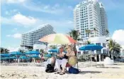  ?? SUSAN STOCKER/STAFF PHOTOGRAPH­ER ?? Mark and Marina Kogan, of Brooklyn, N.Y. are staying at a Fort Lauderdale beach hotel. Hotel demand and rates are up over last year, industry experts say.