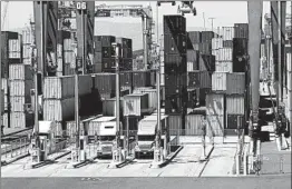  ?? MARCIO JOSE SANCHEZ/AP ?? Cargo is unloaded from trucks at the Port of Long Beach in Long Beach, Calif.