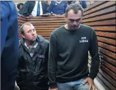  ??  ?? Theo Jackson and Willem Oosthuizen, who allegedly forced a black man into a coffin, appear at the Middelburg Magistrate’s Court. Picture: Itumeleng English