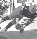  ?? ROB SCHUMACHER/THE REPUBLIC ?? Arizona State’s Eno Benjamin dives for a touchdown against Utah but the play was called back due to an penalty.