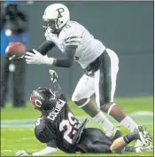  ?? SCNG FILE PHOTO ?? Palo Alto High receiver Davante Adams tries to catch a pass despite the efforts of Corona Centennial’s Izaac Colunga in the CIF Division I State Championsh­ip in 2010.