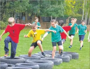  ??  ?? Pupils from Great Chart Primary school enjoyed taking part in the assault course