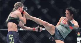  ?? CANADIAN PRESS FILE PHOTO ?? Canadian Valerie Letourneau, right, faces Bellator flyweight champion Ilima-Lei MacFarlane, a Honolulu local, in Saturday night’s MMA bout.