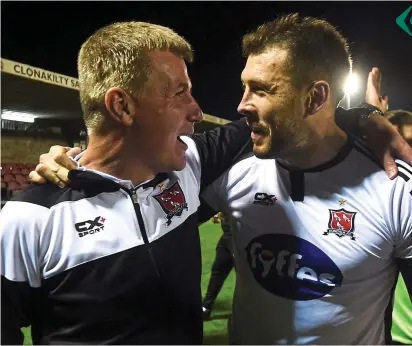  ?? SPORTSFILE ?? Joy: Dundalk boss Stephen Kenny and Brian Gartland after the win over Cork at Turner’s Cross