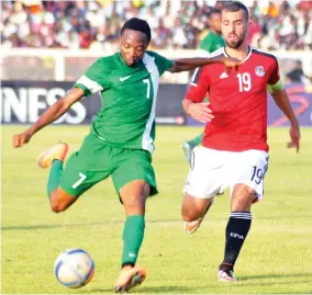  ?? Photo: Shehu K. Goro ?? Super Eagles forward Ahmed Musa and Abdallah Elsaid of Egypt contest for the ball during the first leg of the 2017 AFCON qualifier at Ahmadu Bello Stadium in Kaduna.