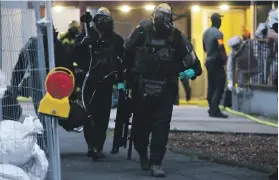  ?? AFP ?? Police officers were yesterday searching a flat in Cologne where ‘unknown substances’ were discovered