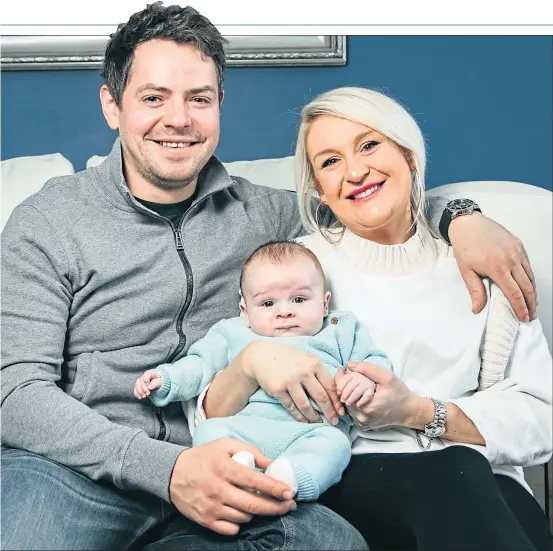  ?? Picture Andrew Cawley ?? Sarah Ballantyne and John Bell with baby Jack at home in Glasgow