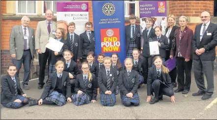  ??  ?? Market Bosworth Dixie Grammar School pupils who are members of the Dixie Diggers school gardening club led by volunteer Judy Buckell, second from right, received a certificat­e of achievemen­t from Bosworth In Bloom volunteers in recognitio­n of the...