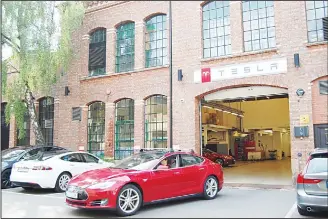  ??  ?? A picture taken on July 31, 2018 shows a Model S electric car of US car maker Tesla leaving a Tesla service center in Oslo, Norway. In the first half of 2018, Tesla has become the fourth company with the highest number ofcomplain­ts to the Norwegian Consumer Council. (AFP)