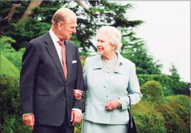  ?? Fiona Hanson/PA Wire / TNS ?? Queen Elizabeth II and the Duke of Edinburgh at Broadlands in November 2007. The couple had a strong bond but were different in character, and the Duke of Edinburgh never shied away from telling his wife exactly what was what. Prince Philip passed away Friday at age 99.