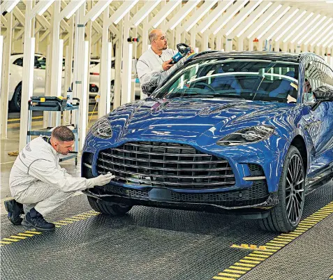  ?? ?? The luxury carmarker said 350 of its DBX 707 SUVS, above, are stuck on the production line awaiting key parts, delayed because of worldwide supply chain problems