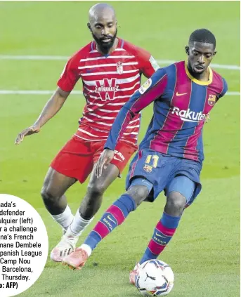  ?? (Photo: AFP) ?? Granada’s
French defender Dimitri Foulquier (left) moves in for a challenge on Barcelona’s French forward Ousmane Dembele during their Spanish League match at Camp Nou stadium in Barcelona, Spain, on Thursday.