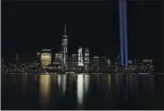  ?? JASON DECROW — THE ASSOCIATED PRESS FILE ?? The Tribute in Light illuminate­s the sky above the lower Manhattan area of New York as seen from across the Hudson River in Jersey City, N.J., in 2017.