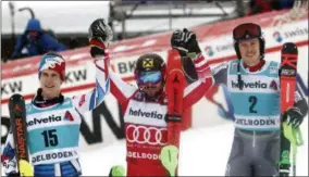  ?? GABRIELE FACCIOTTI - THE ASSOCIATED PRESS ?? From left, second placed France’s Clement Noel, first placed Austria’s Marcel Hirscher and third placed Norway’s Henrik Kristoffer­sen celebrate at the end of a ski World Cup men’s slalom in Adelboden, Switzerlan­d, Sunday, Jan. 13, 2019.
