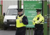  ?? PHOTO: LIAM BURKE/PRESS 22 ?? Alert: Gardaí at the An Post sorting centre on the Dock Road, Limerick.