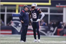  ?? MICHAEL DWYER — THE ASSOCIATED PRESS ?? Patriots special teams star Matthew Slater talks with head coach Bill Belichick prior to a Jan. 1, 2023 game in Foxboro. Sunday may mark the final game with the Patriots for both Belichick and Slater.