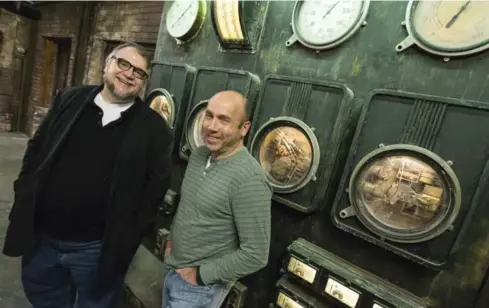  ?? BERNARD WEIL/TORONTO STAR ?? The Strain creator Guillermo del Toro, left, and producer Miles Dale on the set of the Toronto-filmed TV show.