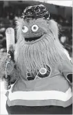  ?? TOM MIHALEK THE ASSOCIATED PRESS ?? The Philadelph­ia Flyers’ new mascot, Gritty, has created plenty of online buzz for its odd appearance and intense vibe.