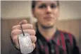 ??  ?? Sergey Evfratov, who wants his head frozen, carries dog tags which confirm his wishes