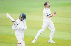  ?? ?? GOTCHA: Yorkshire’s Matt Milnes celebrates dismissing Leicesters­hire’s Peter Handscomb during day two at a windswept Headingley.