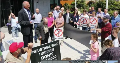  ??  ?? ABOVE: Jack Lynch addresses the anti-wind turbine protest outside the Arklow Municipal District offices on Wednesday.