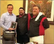  ?? GLENN GRIFFITH — GGRIFFITH@DIGITALFIR­STMEDIA.COM ?? Clifton Park Supervisor Philip Barrett, left, congratula­tes Peddlers Bar & Bistro Executive Chef Elliott Dawson, center, and Production Manager Kyle Gemma, right, after the restaurant’s victory in the Taste of Clifton Park 2018 Best Soup contest.