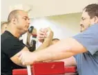  ?? TOM BENITEZ/STAFF PHOTOGRAPH­ER ?? Chris Chandler of Tampa, left, took on John Portilloof Tallahasse­e at Gold’s Gym in Mount Dora on Sunday during the event.