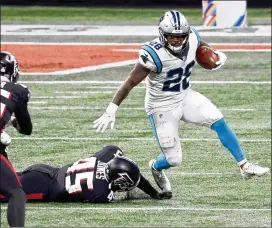  ?? JASON GETZ FOR THE AJC ?? Former Panthers running back Mike Davis, eluding the Falcons’ Deion Jones last season, reportedly agreed to a two-year, $5.5 million contract. The former Stephenson High star is also a receiving threat out of the backfield.