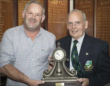  ??  ?? Winner of the Baltinglas­s Golf Club captain’s prize Ned Cremin collects his award from Club Captain Louie Fagan.