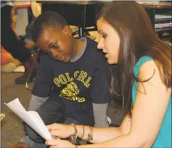  ?? SUBMITTED PHOTOS ?? Nicolas Reid, left, goes over an assignment with his teacher, Jillian Durr, who was named the 2016 Charles County Teacher of the Year.