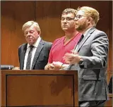  ?? LAWRENCE BUDD / STAFF ?? John Austin Hopkins (center) listens as attorney David Anthony Chicarelli (right) argues for reasonable bail. Attorney David A. Chicarelli stands at left.