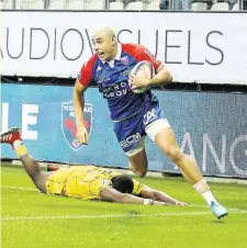  ?? Photo Jacques Robert ?? À la 35e minute, l’ailier grenoblois Karim Qadiri inscrit l’unique essai du match.