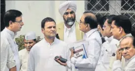  ?? ARVIND YADAV/HT PHOTO ?? Congress vicepresid­ent Rahul Gandhi with P Chidamabar­am (holding books) and party spokespers­on Randeep Singh Surjewala (left), in New Delhi on Monday.
