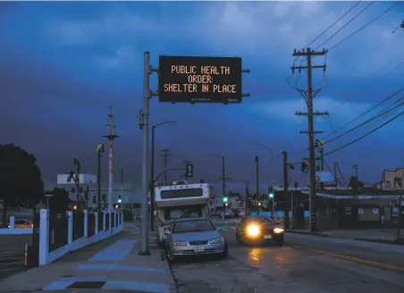  ?? Gabrielle Lurie / The Chronicle ?? A sign posted outside Cornerston­e Missionary church in the Bayview in San Francisco advises people to remain at home.